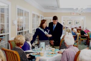 Group of people talking at an anniversary party