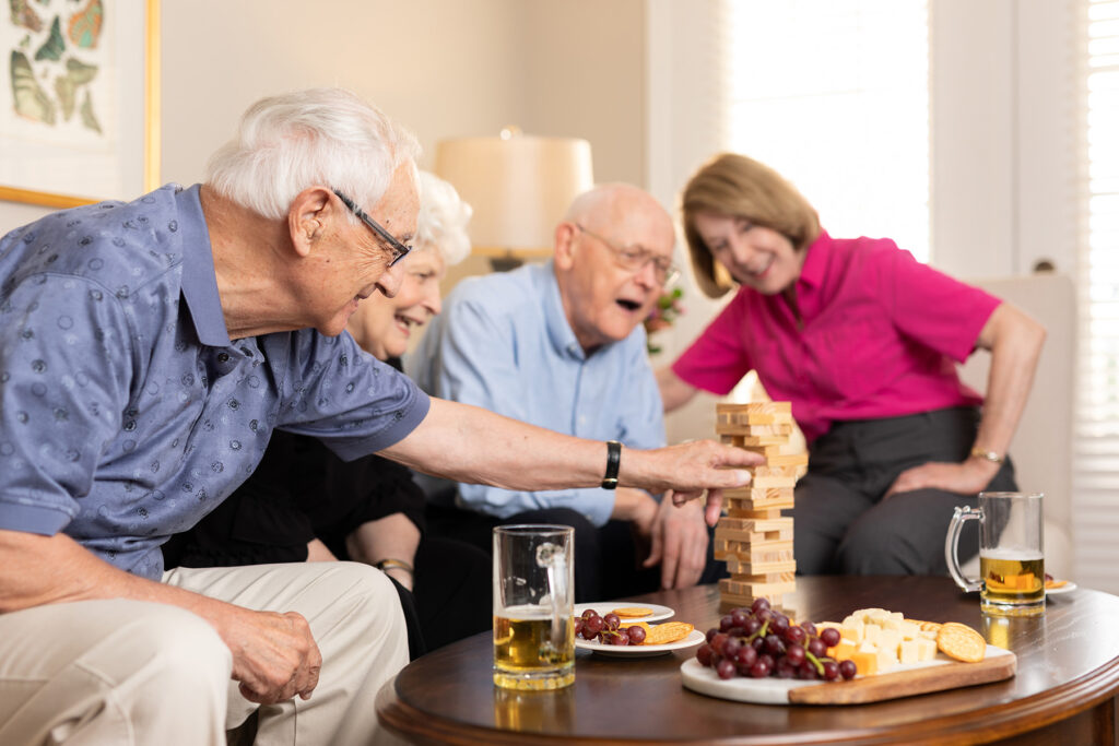 group of senior residents playing games and eating together