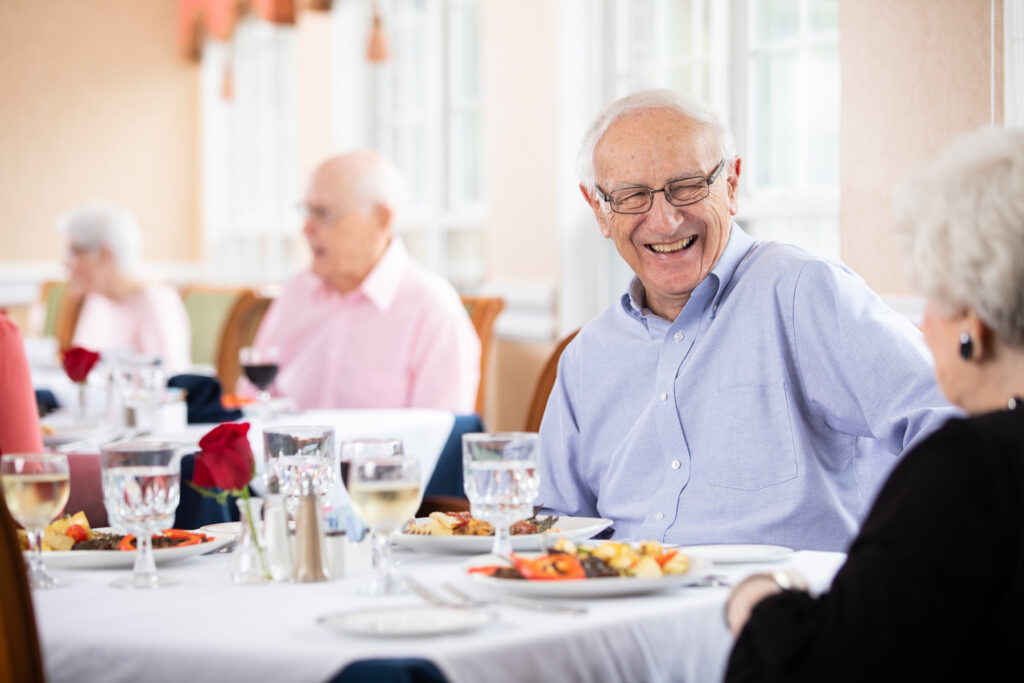 senior couple having lunch together at independent living community