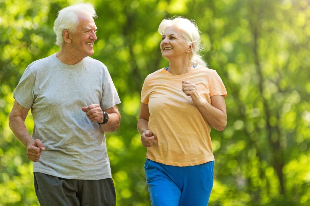 active adults, couple walking on a beautiful path