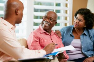 Financial advisor speaking with senior couple