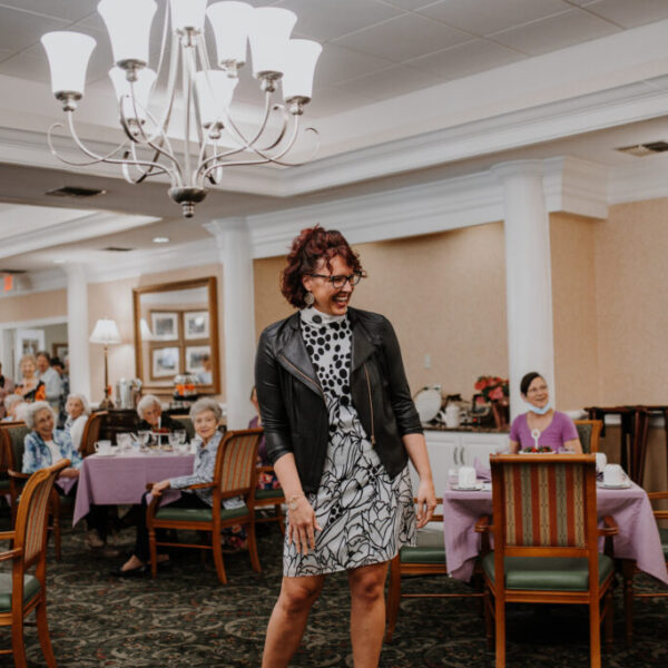 Staff member posing for the camera at the fashion show