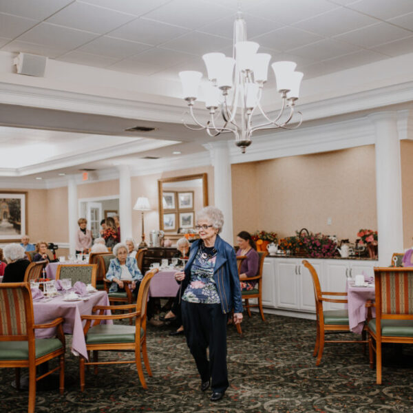 Resident walking around and showing her outfit at the fashion show