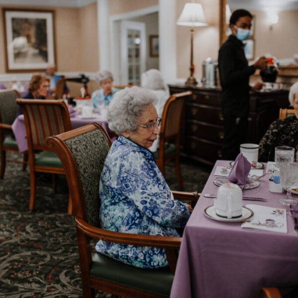 Resident socializing with others at the fashion show