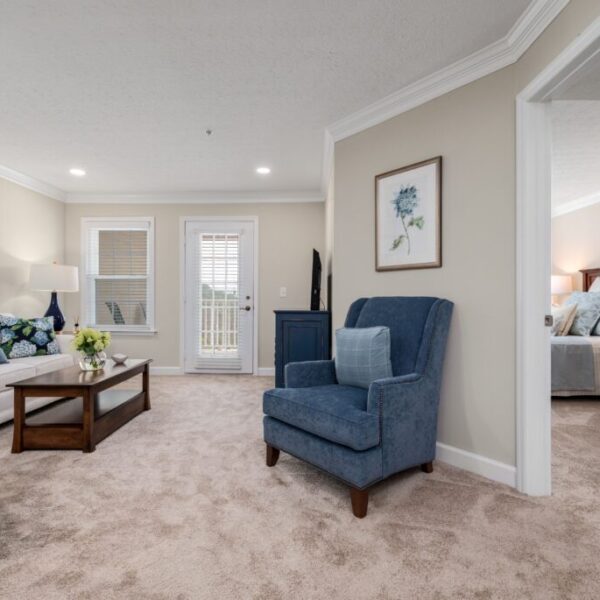 Sample bedroom and living room of apartment at Edgewood Summit