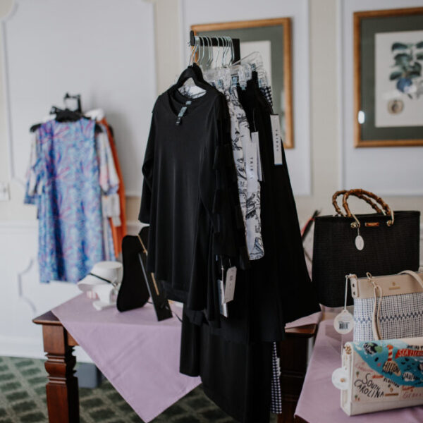 Clothes and handbags displayed for the fashion show