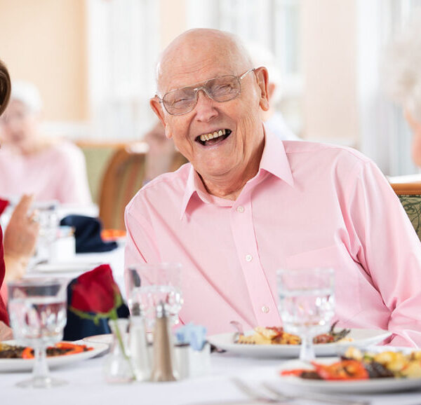 Residents happily enjoying their dinner and each other's company