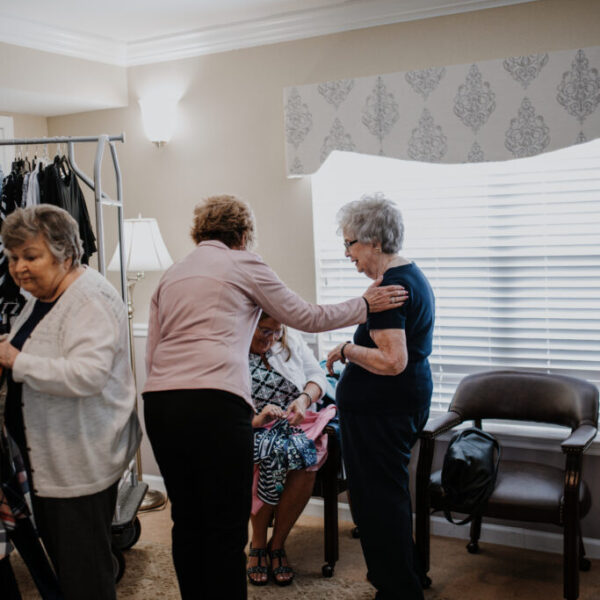 Residents interacting at the fashion show