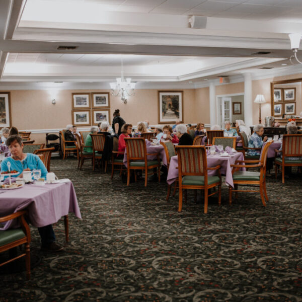 Residents socializing and waiting for the fashion show to start