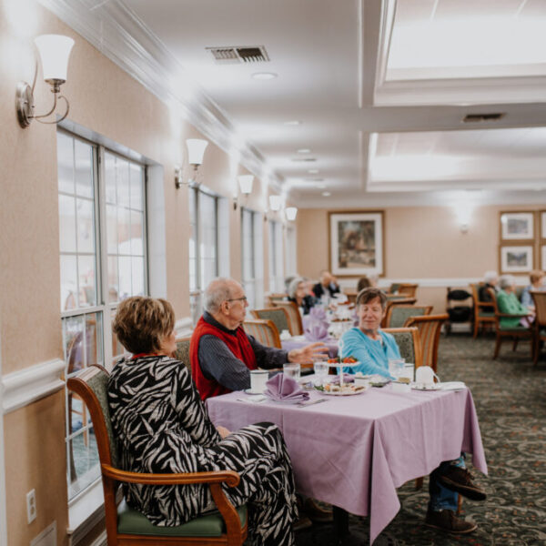 Residents socializing as they wait for the fashion show to start