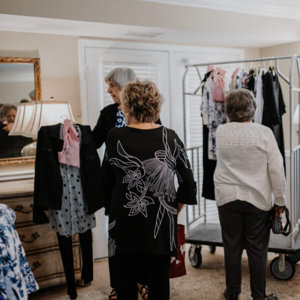 Residents looking different clothes at the ladies fashion show