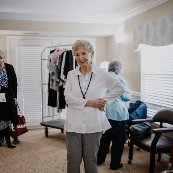 Resident standing excitedly for the fashion show