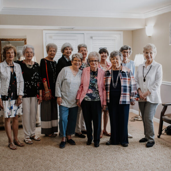 Residents who organized the fashion show gathered for a picture