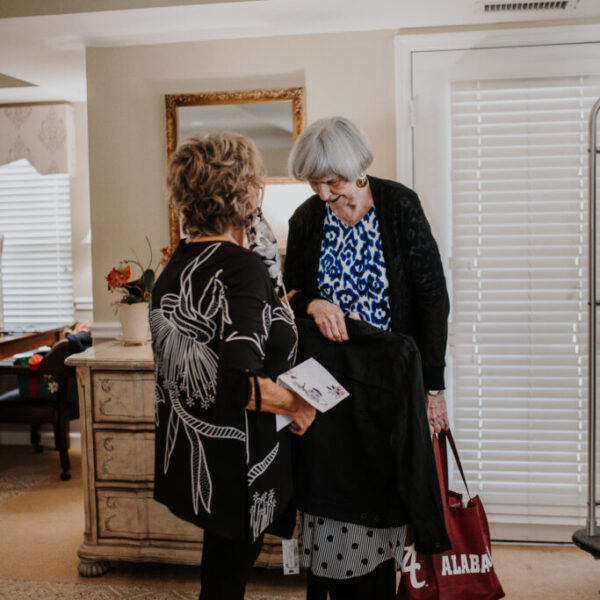 Residents interacting at the fashion show