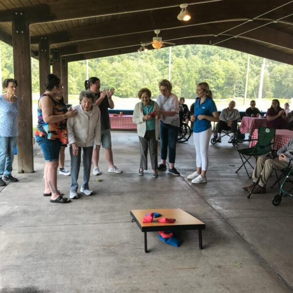 Reisdents playing corn-hole