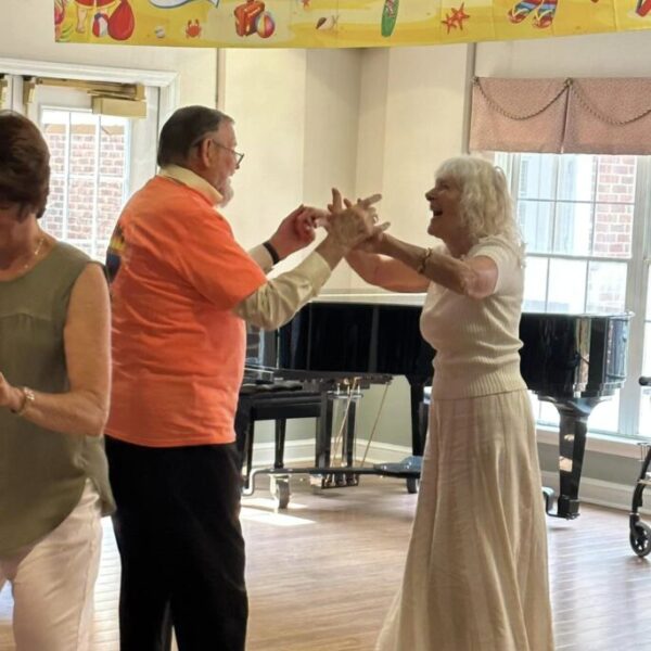 Couple dancing together for the Christmas in July Dance