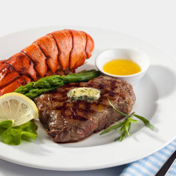 A plate of steak and lobster tail