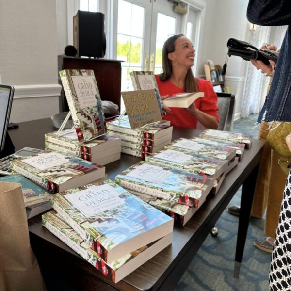 Author Joy Calleway completing a book signing at Edgewood Summit