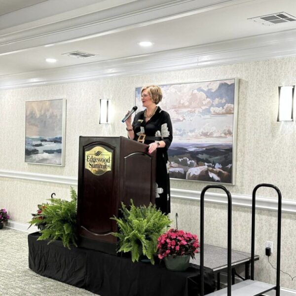 Staff member talking at the luncheon