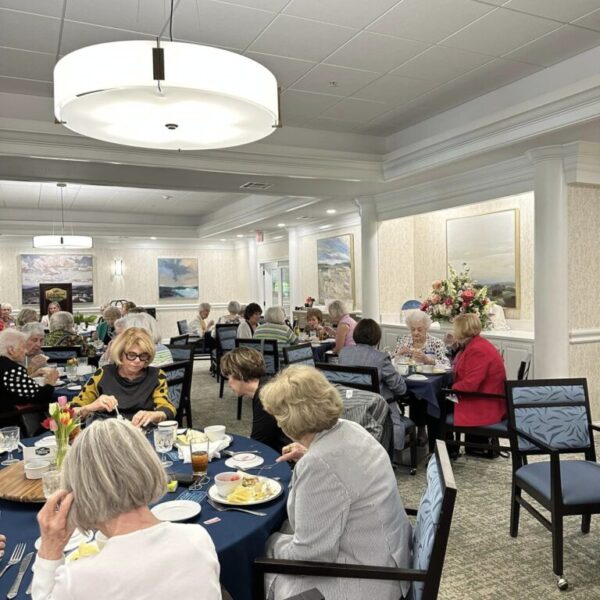 Residents and their families enjoying their lunch for the Mother's Day luncheon