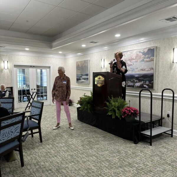 Staff member speaking at the Mother's Day luncheon