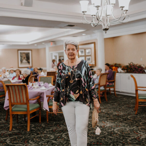 Resident walking around and viewing the displays at the fashion show