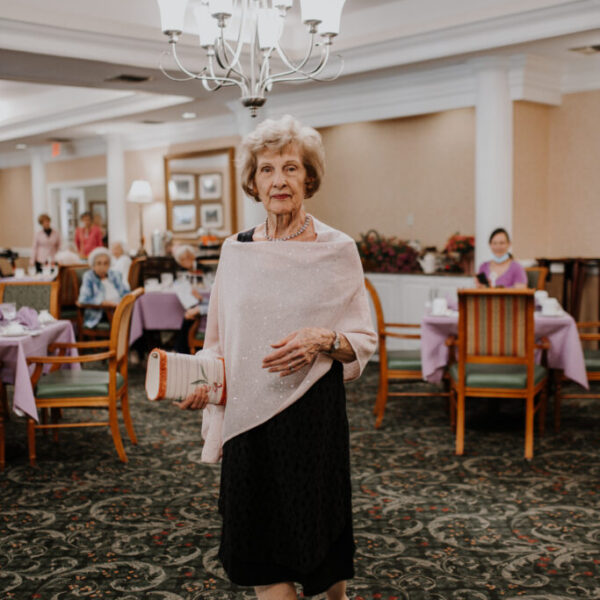 Resident walking around and viewing the displays at the fashion show