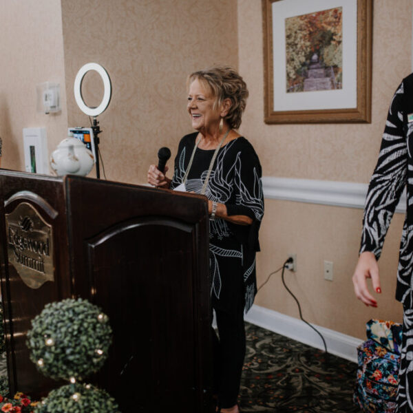 Staff member speaking at the podium