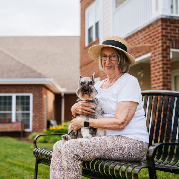 A female resident posing with her dog