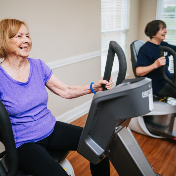 Senior women using the seated eliptical