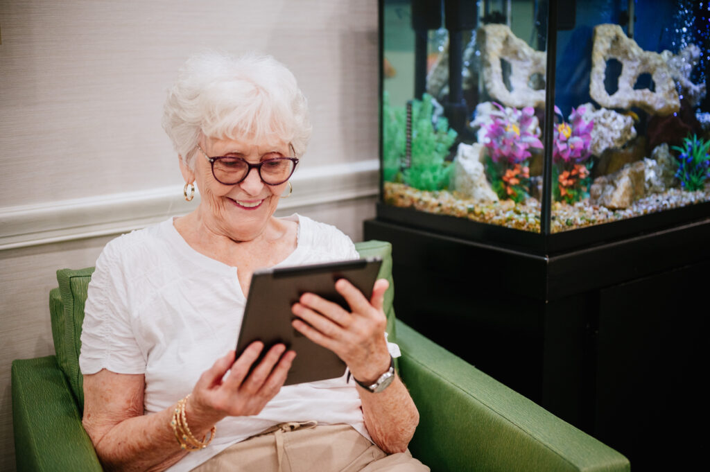 Resident watching something on a tablet