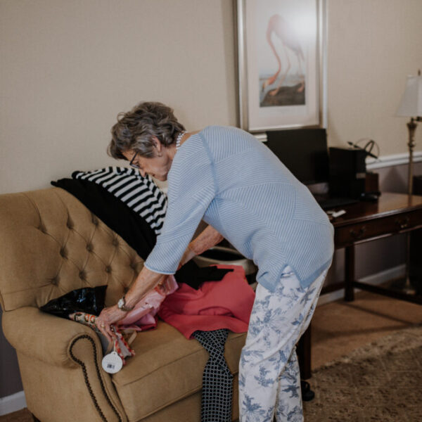 Resident preparing outfits for the fashion show