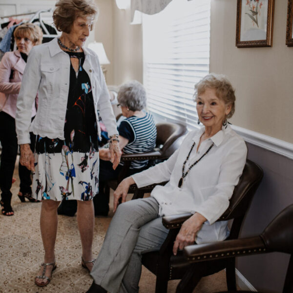 Residents preparing for the fashion show backstage