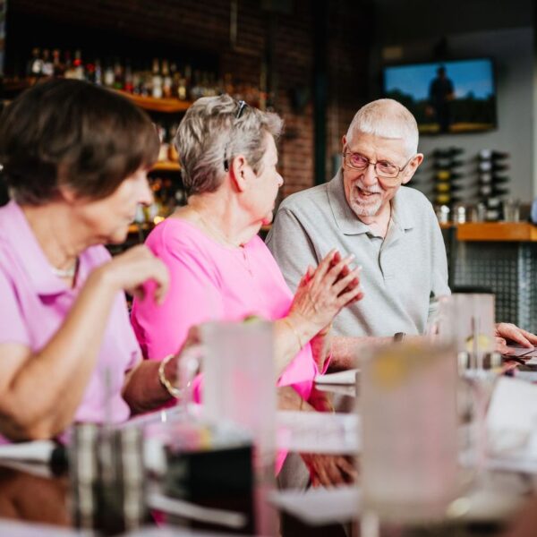 Seniors enjoying a night at a wine bar