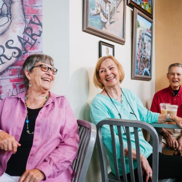 A group of three seniors enjoying coffee and each other's company