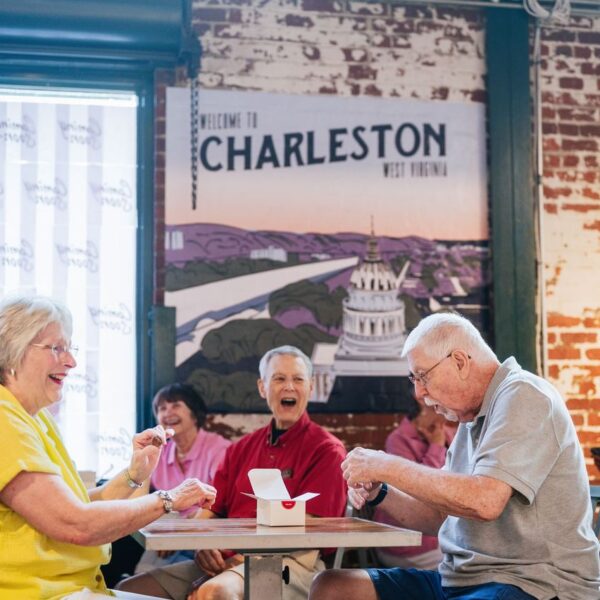 Seniors in a coffee house enjoying themselves