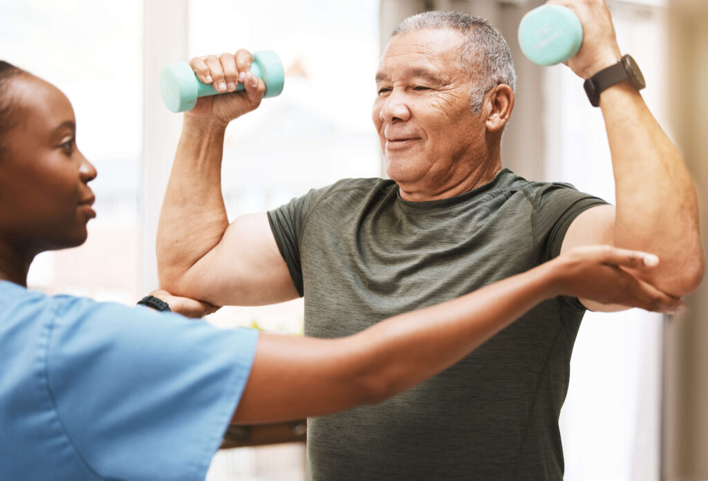 Physical therapist helping a patient with exercise