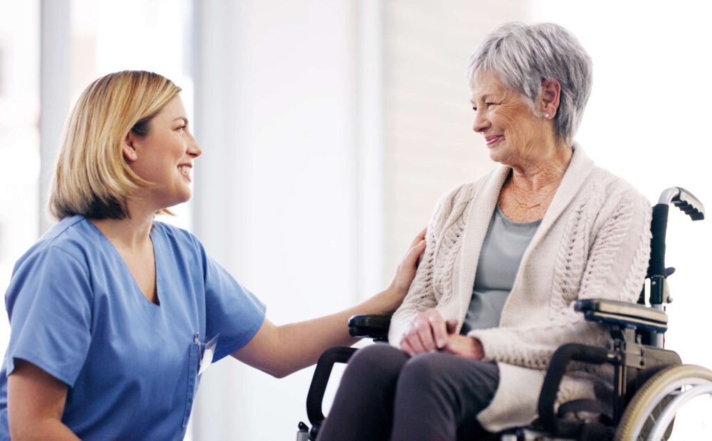 A caregiver looking proudly at her patient